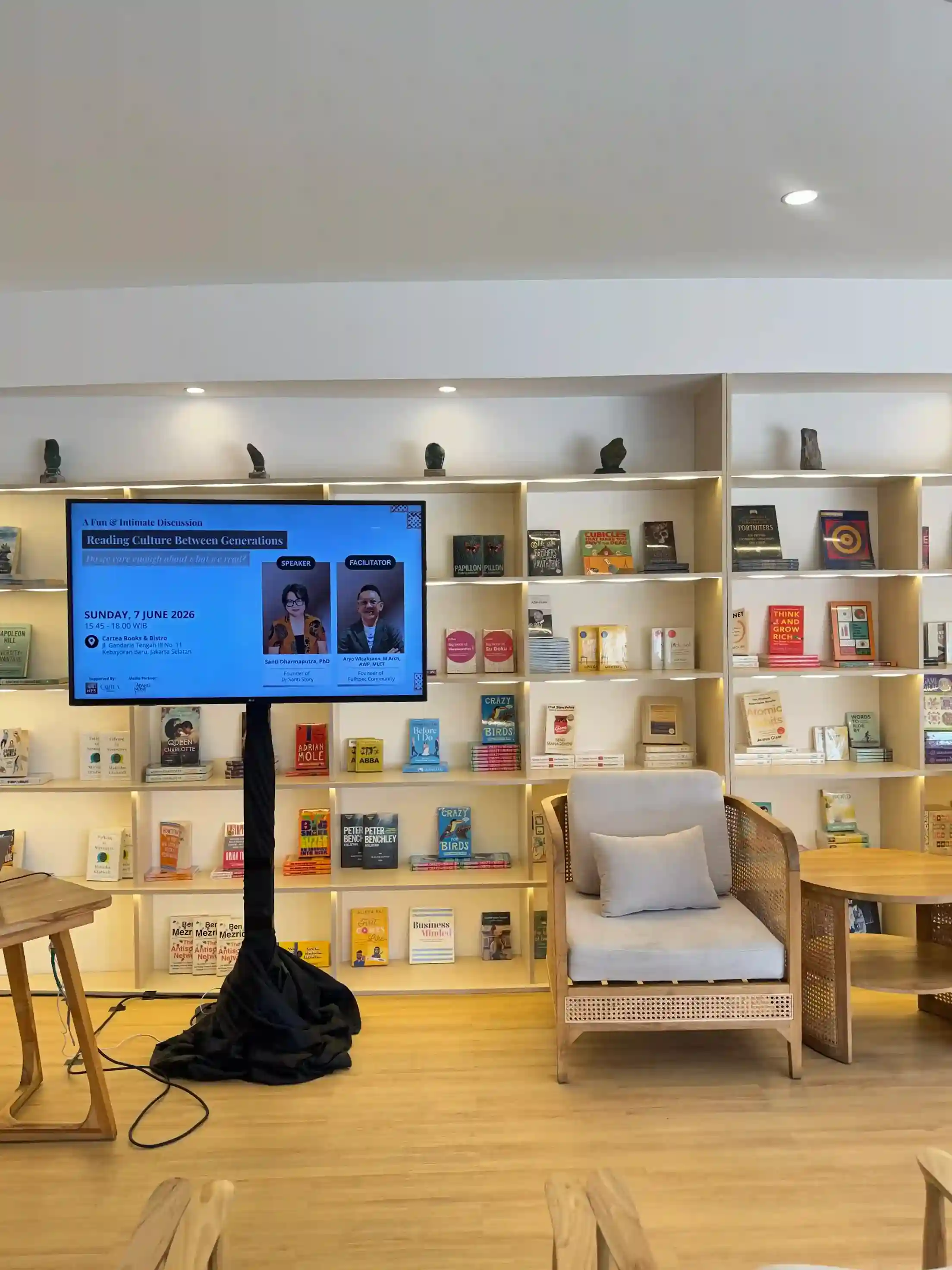 Guests gathered around books and conversation